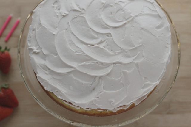 Low sugar lightened up moist vanilla cake with strawberry frosting. www.superhealthykids.com