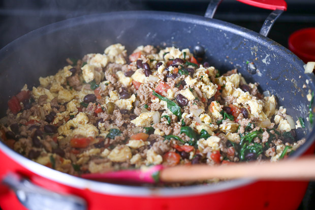 How to make Protein Packed Breakfast Burritos, meat, eggs, beans, spinach, tomato, onion cooking