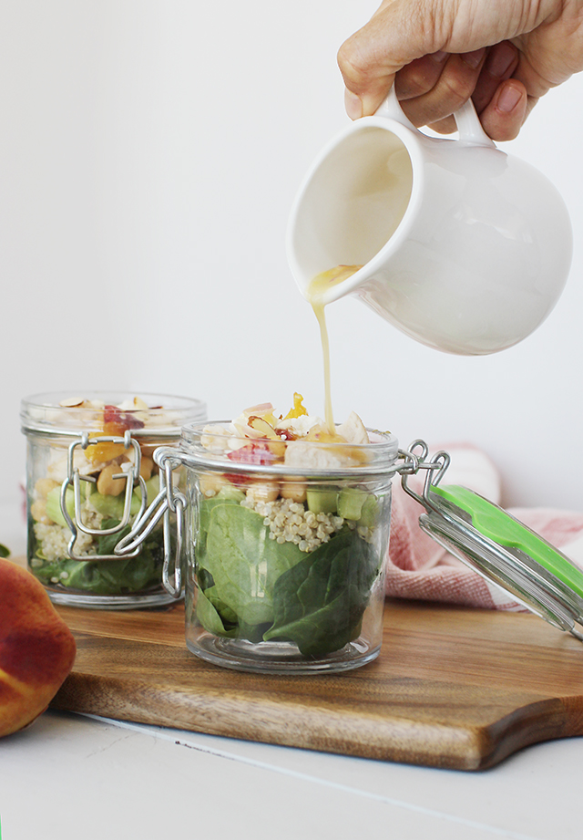 Sweet and Savory Peach Quinoa Salad with Dressing Being Poured